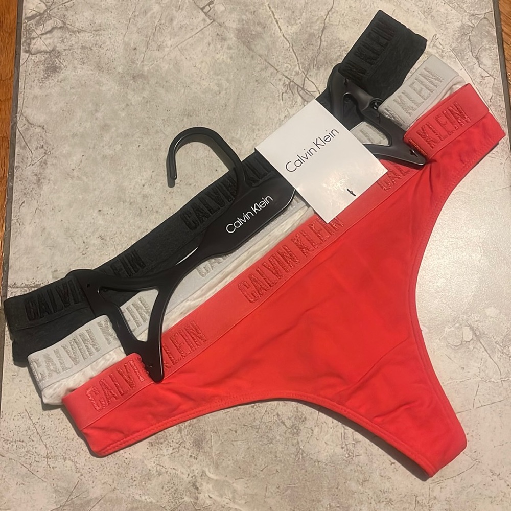 Calvin Klein woman’s size medium 3 pack NWT on hanger Thongs